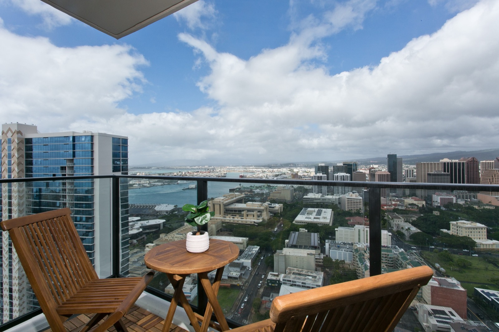 Private lanai with panoramic city and ocean views